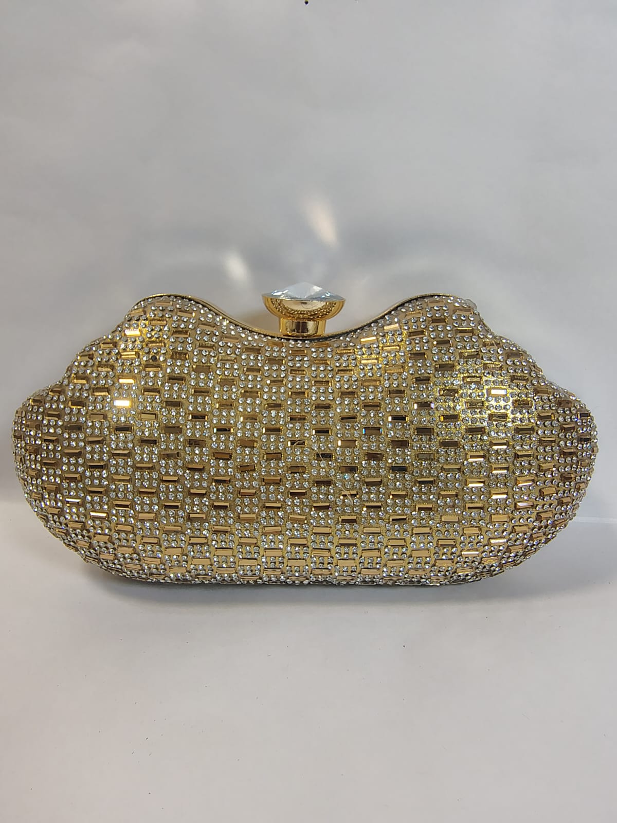 Stylish Wincham Fashion House gold clutch handbag with shimmering embellishments