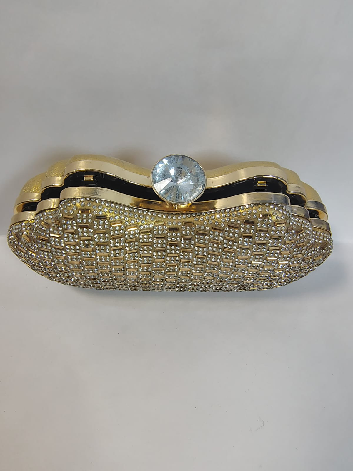 Elegant Wincham Fashion House gold clutch handbag with crystal embellishment for evening events