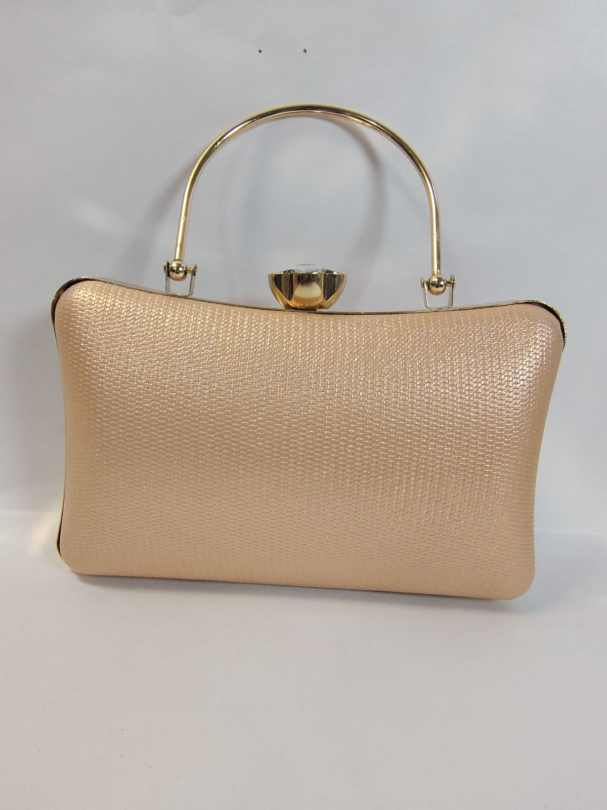 Elegant Wincham Fashion House gold clutch handbag with a stylish handle and textured finish
