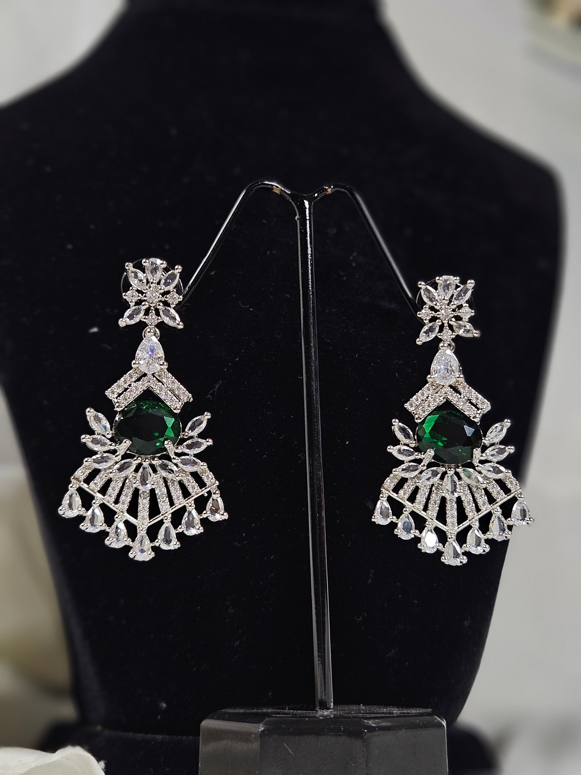 Wincham Fashion House green AD stone necklace and earring set featuring intricate silver design with green stones