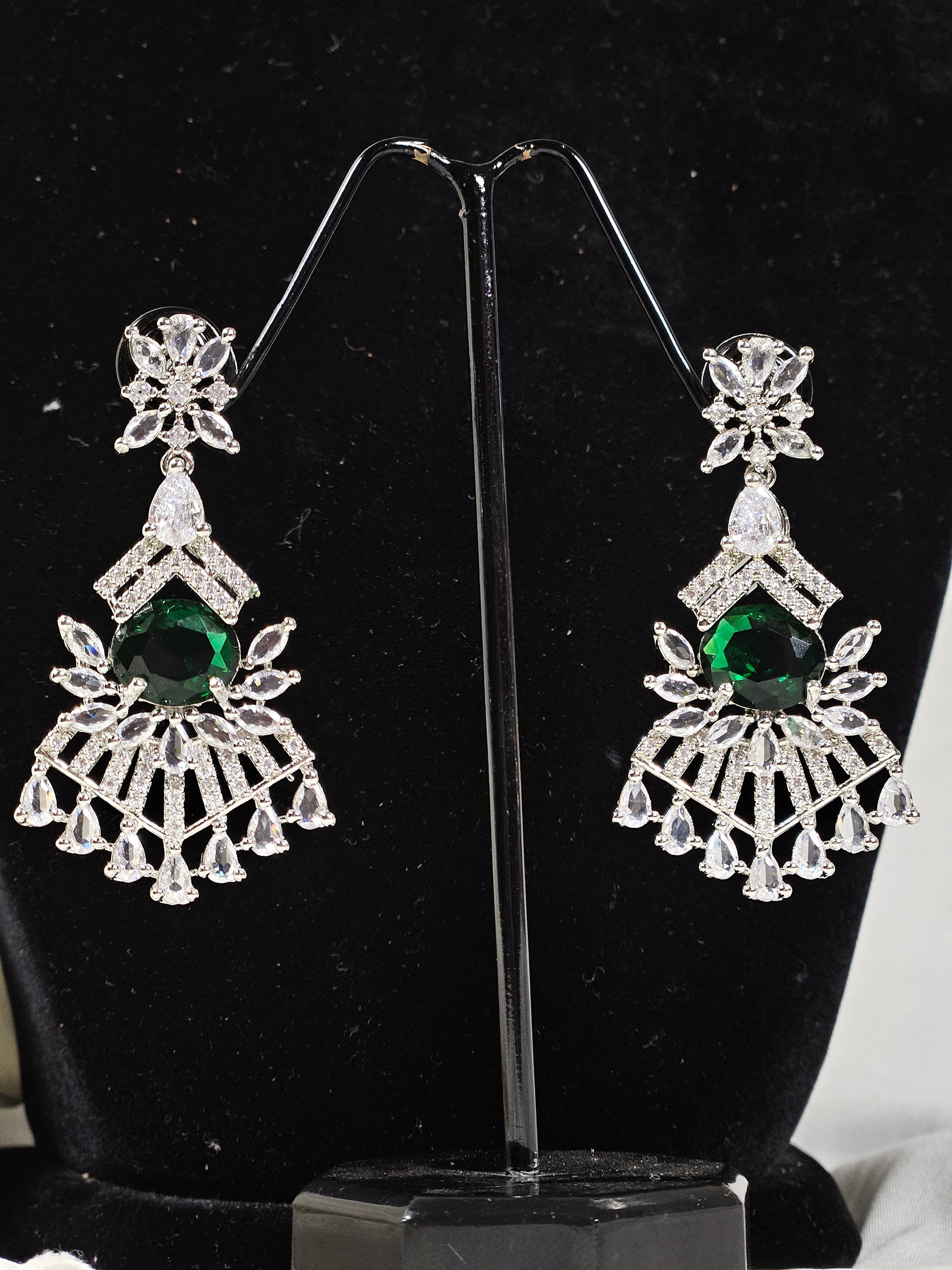 Green AD stone necklace and earring set featuring silver-tone intricate design with vibrant green stones and clear crystals
