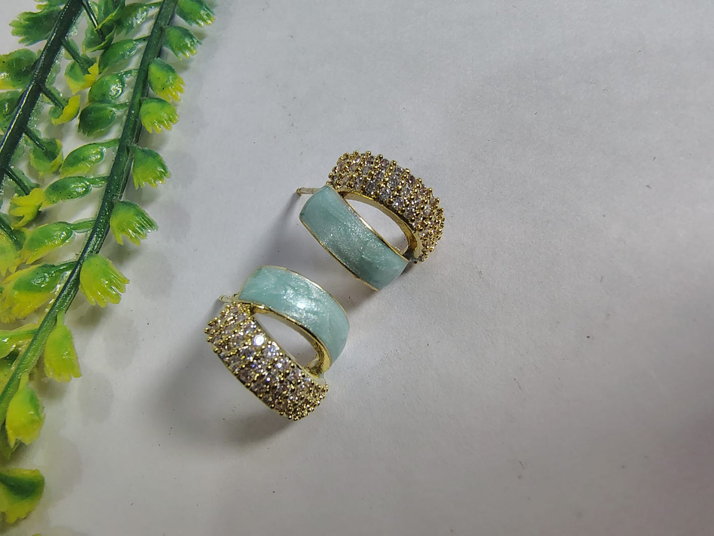 Elegant Wincham Fashion House hoop AD earrings in gold plated with sparkling stones and a mint accent