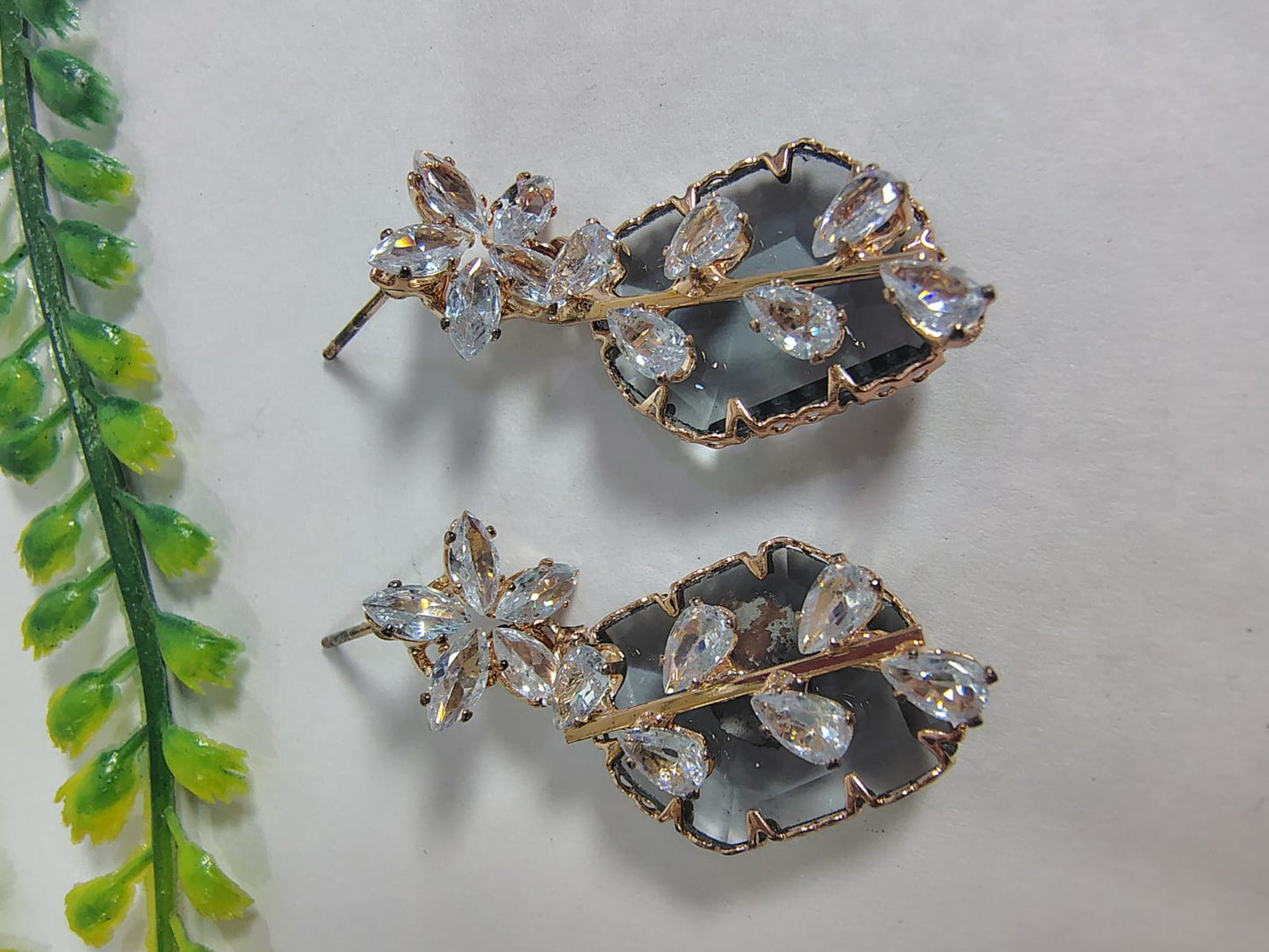 Elegant Wincham Fashion House stud diamond earrings featuring a floral design with sparkling crystals