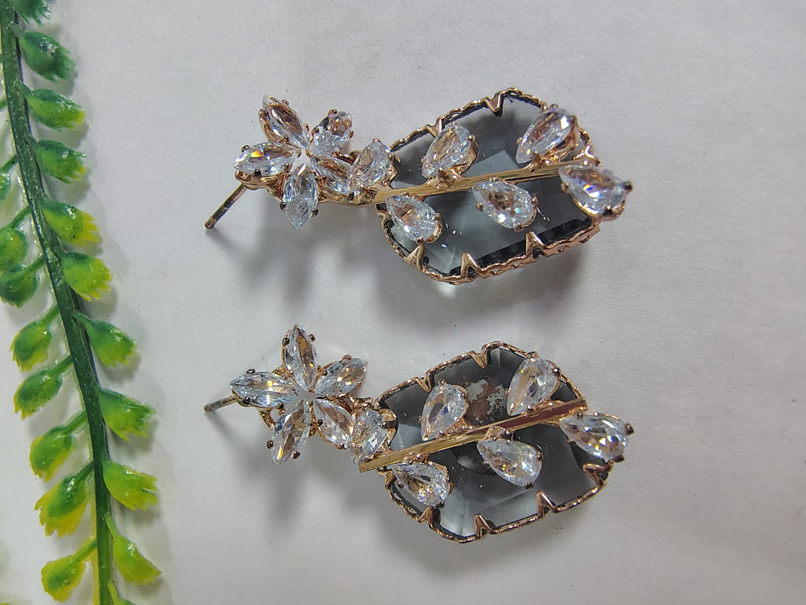 Elegant Wincham Fashion House stud diamond earrings featuring a floral design with sparkling crystals