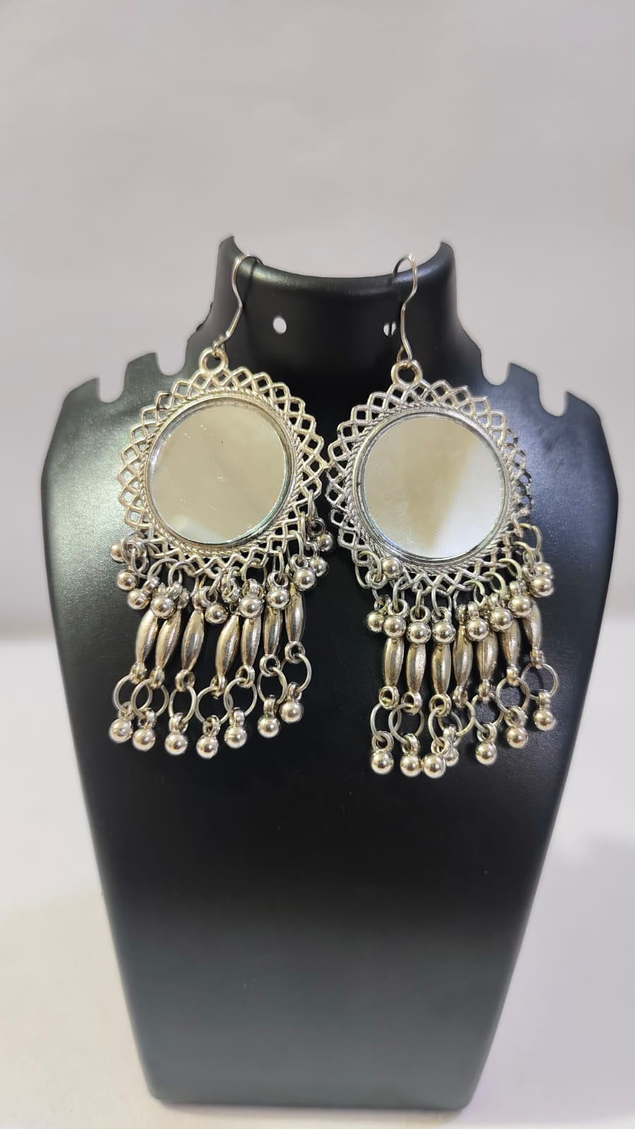 Stylish mirror dangler earrings with intricate silver detailing and hanging beads for a chic look