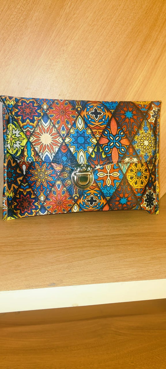 Wincham Fashion House multicolor hand purse with intricate geometric and floral patterns and a front clasp closure