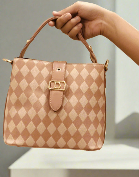 Hand holding a pink leather purse for women with diamond pattern and gold buckle