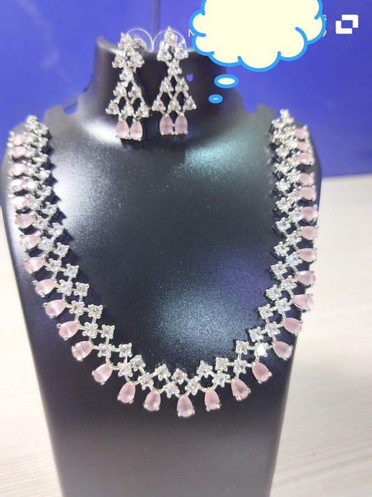 Wincham Fashion House pink stone necklace AD set with matching earrings displayed on black stand