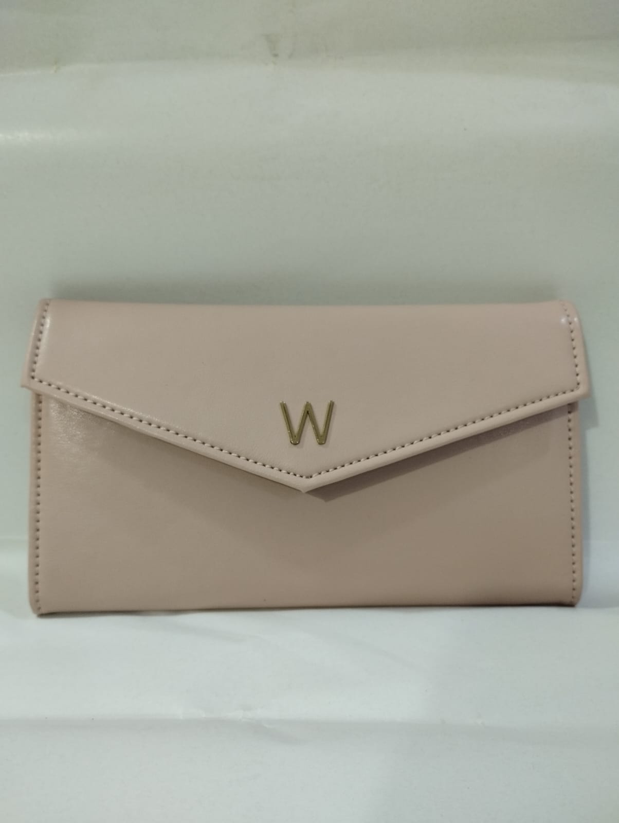Wincham Fashion House small hand bag purse in soft pink with a stylish envelope design