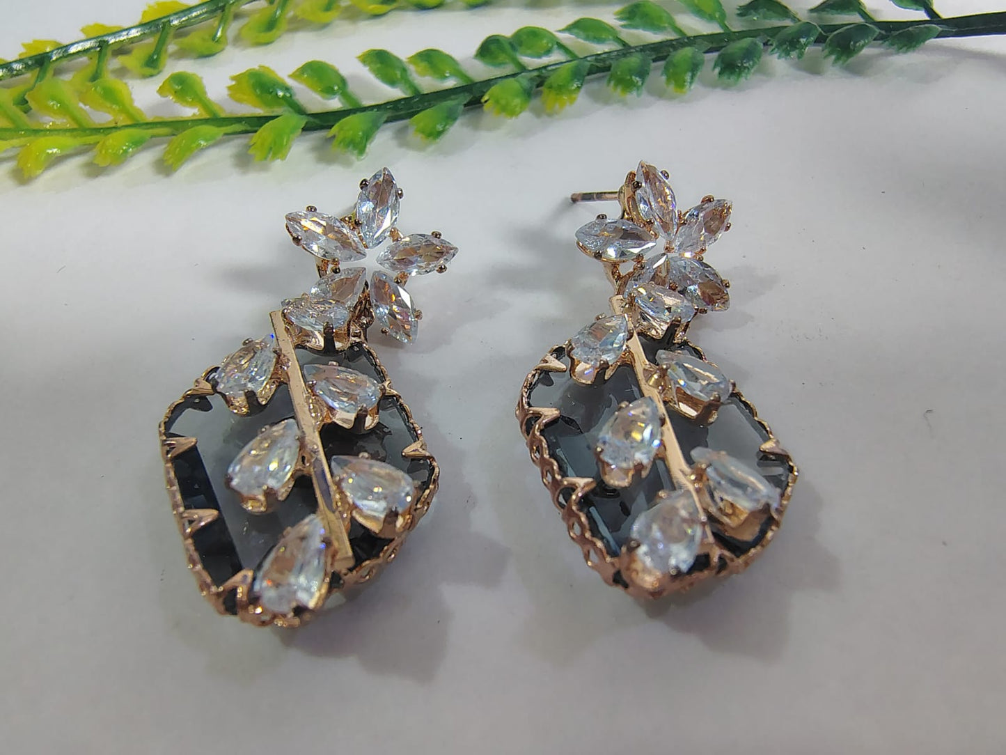 Elegant stud diamond earrings with floral design and sparkling crystal accents