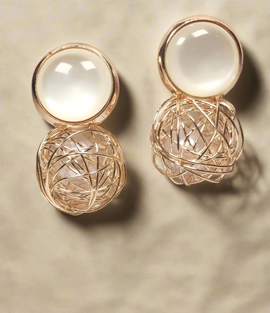 Korean pearl gold earrings by Wincham Fashion House with intricate wire design and smooth pearl accents