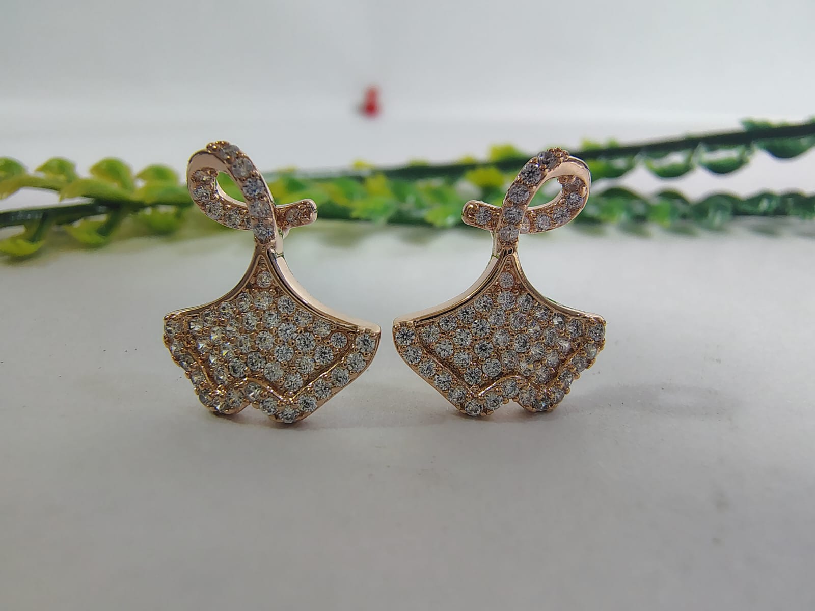 Elegant rose gold earrings with sparkling rhinestones, perfect to pair with women tops korean